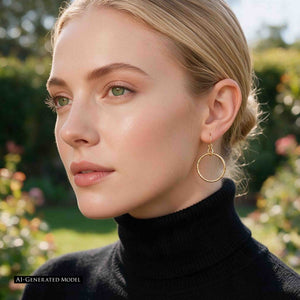 2 of 8: AI generated blonde model wearing a 1 Inch Texturized Rim Bronze Hoop Earring with a black turtleneck. The polished textured bronze hoop hangs beside the jawline while soft outdoor garden light shows its warm color and everyday scale.