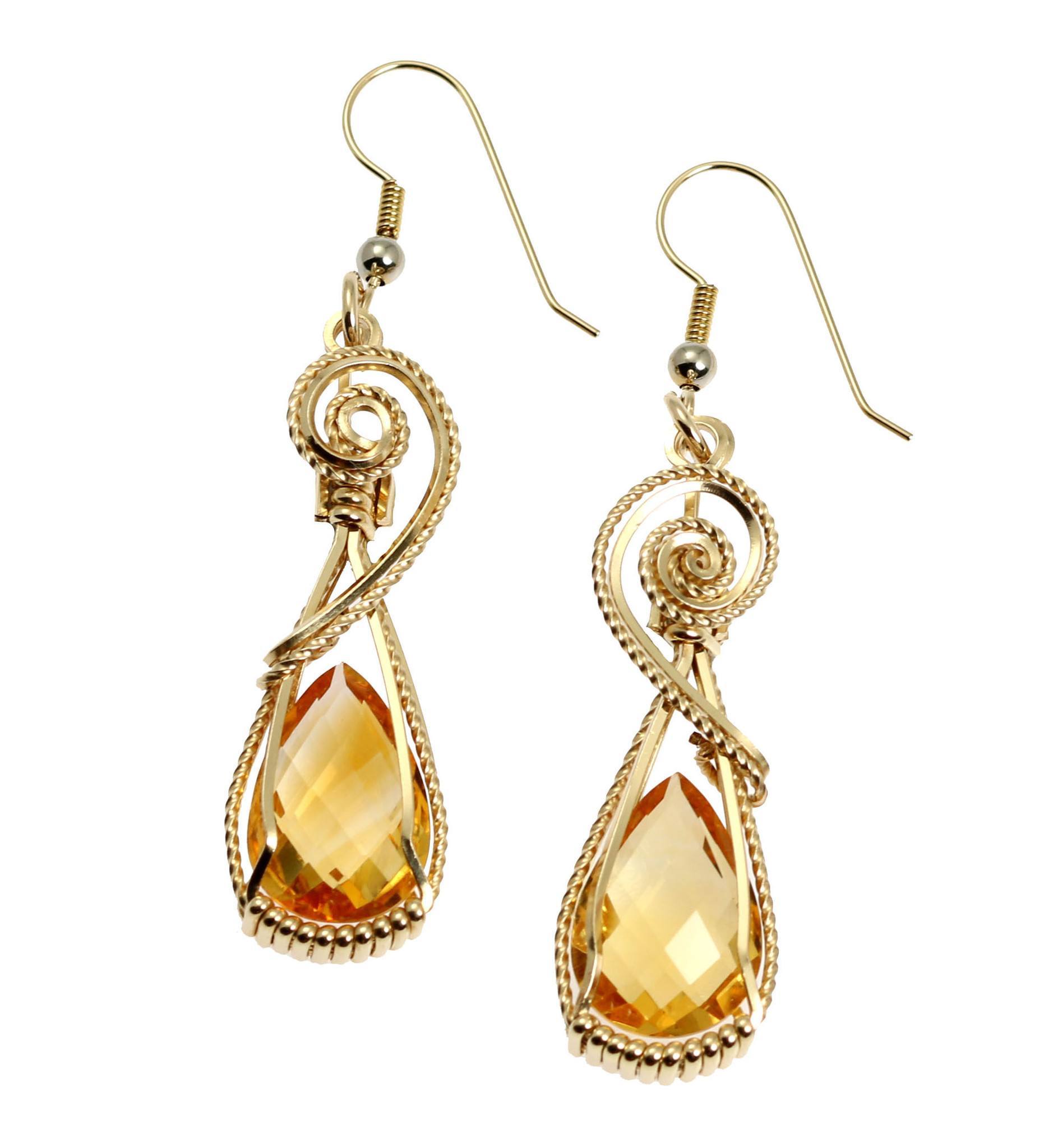 A Pair of 21 CT Checkerboard Cut Citrine 14K Gold-filled Earrings on a White Background