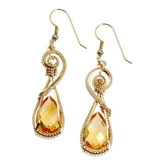 1 of 4: A Pair of 21 CT Checkerboard Cut Citrine 14K Gold-filled Earrings on a White Background
