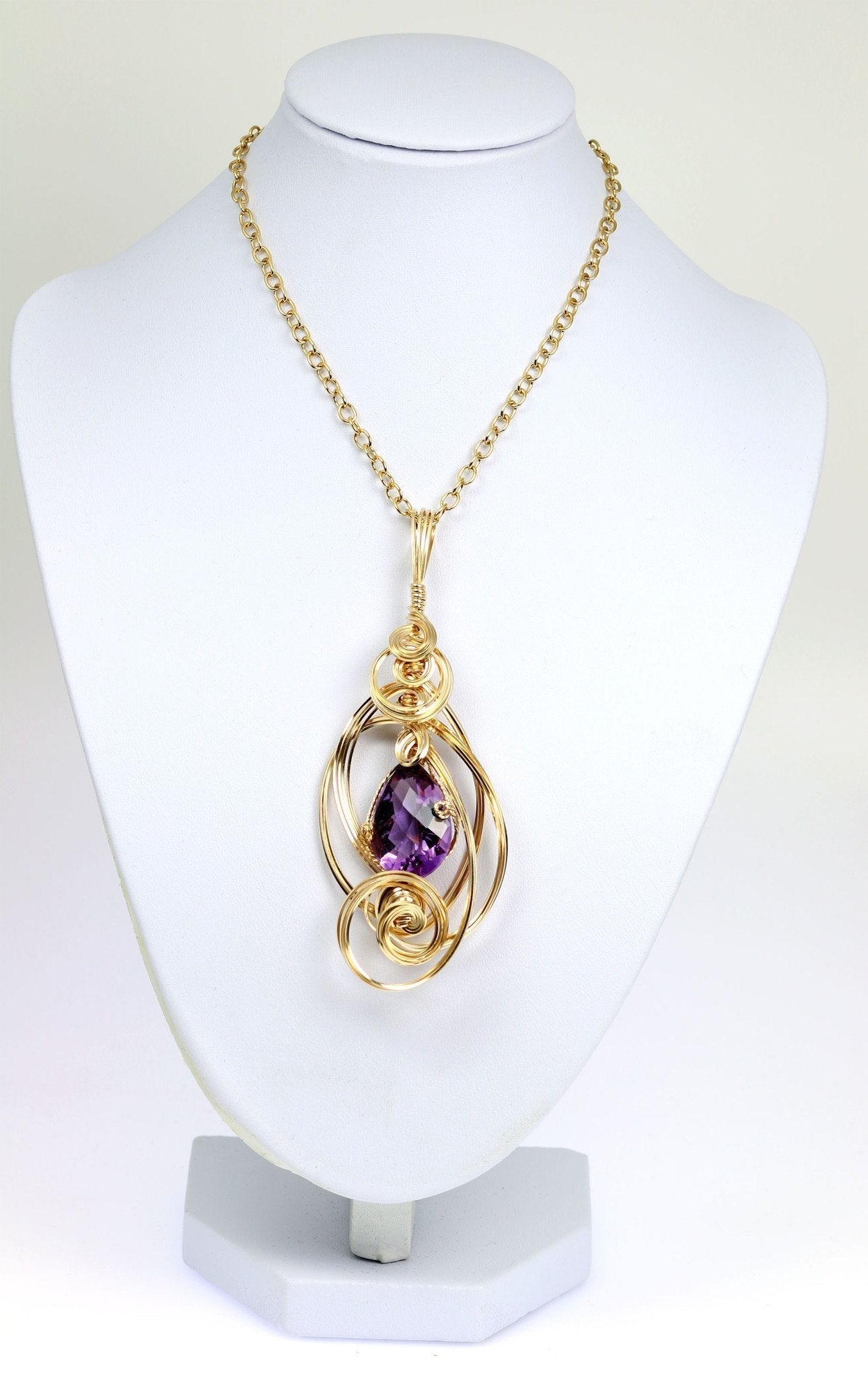 Amethyst 14K Gold-filled Wire Wrapped Pendant With Chain on a White Neck Display