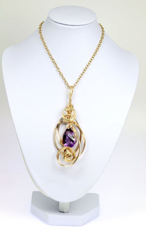 3 of 4: Amethyst 14K Gold-filled Wire Wrapped Pendant With Chain on a White Neck Display