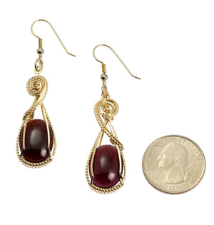 2 of 4: Size of 23 CT Cabochon Cut Garnet 14K Gold-filled Earrings compared to a US Quarter Coin