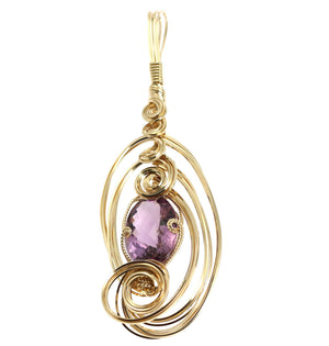 1 of 4: A 25.5 Ct Amethyst 14K Gold-filled Wire Wrapped Pendant on a White Background