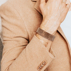 2 of 9: Stylish Man in Tan Sportscoat Wearing Men's 3/4 Inch Wide Mosaic Embossed Solid Copper Cuff 