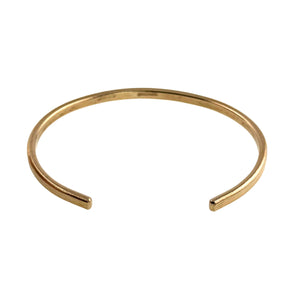 8 of 9: A handcrafted 3.5mm wide solid bronze cuff bracelet with a subtle bark-textured finish, shown from a front-facing angle. The bracelet has a warm golden-bronze tone and an open-ended, curved design for easy wear. Its slim profile and clean lines highlight its minimalist and earthy aesthetic, ideal for both casual and dressy looks.