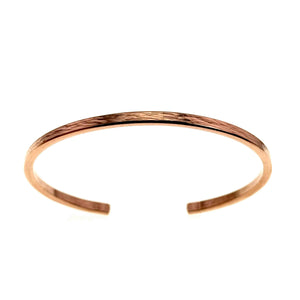 3 of 10: A front-facing image of a handcrafted 3.5mm wide copper cuff bracelet with an open-ended design. The bracelet is made from solid, raw copper and features a lightly embossed bark texture along its outer surface, adding a natural, organic touch. Its smooth, polished finish reflects light subtly, highlighting the warm reddish tones of the copper. The open gap allows for adjustable wear and easy fit. The bracelet is photographed against a clean white background, making its slim profile and artisanal details cle