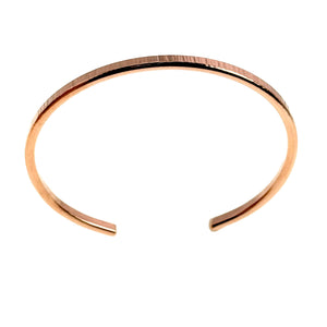 5 of 11: A handcrafted 3.5mm wide raw copper cuff bracelet with a lightly textured chased finish, displayed against a white background in an open-ended, circular shape.