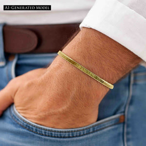 8 of 9: Close-up of a man's wrist wearing a slim 3.5mm chased Nu Gold brass cuff bracelet with a subtle ridged texture. The bracelet has a warm golden tone and minimalist design, complementing the casual outfit of a white shirt, brown belt, and blue jeans. The man's hand is relaxed and resting in his pocket, showcasing the bracelet's understated, everyday style.  AI Generated Model.