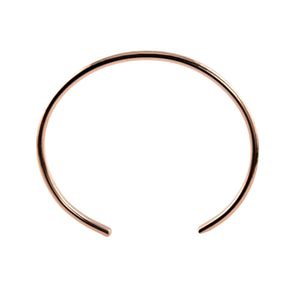 5 of 9: Top-down view of a 3.5mm hand-hammered copper cuff bracelet set against a white background. The bracelet has an open-ended design with smooth, rounded tips and a gently curved shape that fits around the wrist. Its warm, polished copper surface subtly reflects light, showcasing the handcrafted texture. The slim, minimalist style makes it suitable for everyday wear or as a thoughtful gift.