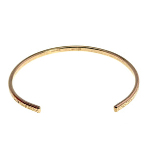 3 of 10: Top view of a handcrafted 3.5mm linen bronze cuff bracelet with an open, curved design. The slim band features a subtle hand-hammered texture along the outer edge and a smooth inner surface. Warm golden bronze tone displayed on a clean white background, highlighting its minimalist and lightweight style.