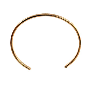 5 of 10: Front-facing view of a slim 3.5mm linen bronze cuff bracelet with an open, rounded shape. The bracelet features a softly hammered texture along the outer surface and a smooth inner finish, displayed on a clean white background to highlight its warm golden bronze tone and minimalist design.