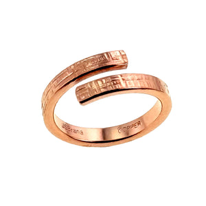 3 of 9: Handmade 3.5mm  copper bypass ring with linen textured finish, shown from a side angle on a white background