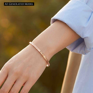 2 of 11: Close-up of a person’s wrist wearing a slim 3.5mm solid copper cuff bracelet with a subtle crosshatch linen texture. The open cuff design sits lightly on the wrist, paired with a light blue long sleeve shirt, against a softly blurred outdoor background with warm natural tones.  AI Generated Model.