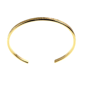 9 of 10: Top view of the handmade 3.5mm Linen Nu Gold Brass Cuff Bracelet in solid raw Nu Gold Brass. The slim open cuff features a polished finish with a hand applied linen texture along the outer surface, highlighting its minimalist handcrafted design.