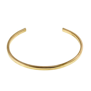 7 of 10: Front view of the 3.5mm matte Nu Gold brass cuff bracelet on a white background, with the opening facing upward and the hand brushed finish visible across the narrow curved band.