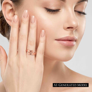 8 of 9: Close view of a woman with closed eyes touching her cheek while wearing a polished copper bypass ring. The slim ring wraps around her finger with two open ends and a hand applied texturized finish.  AI Generated Model.