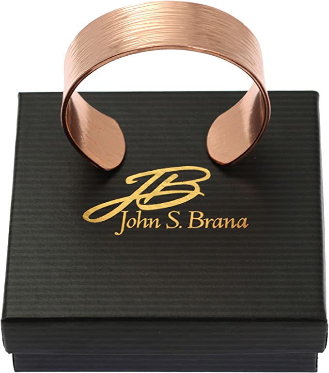3/4 Inch Wide Chased Copper Bark Cuff Bracelet on top of a Black Gift Box