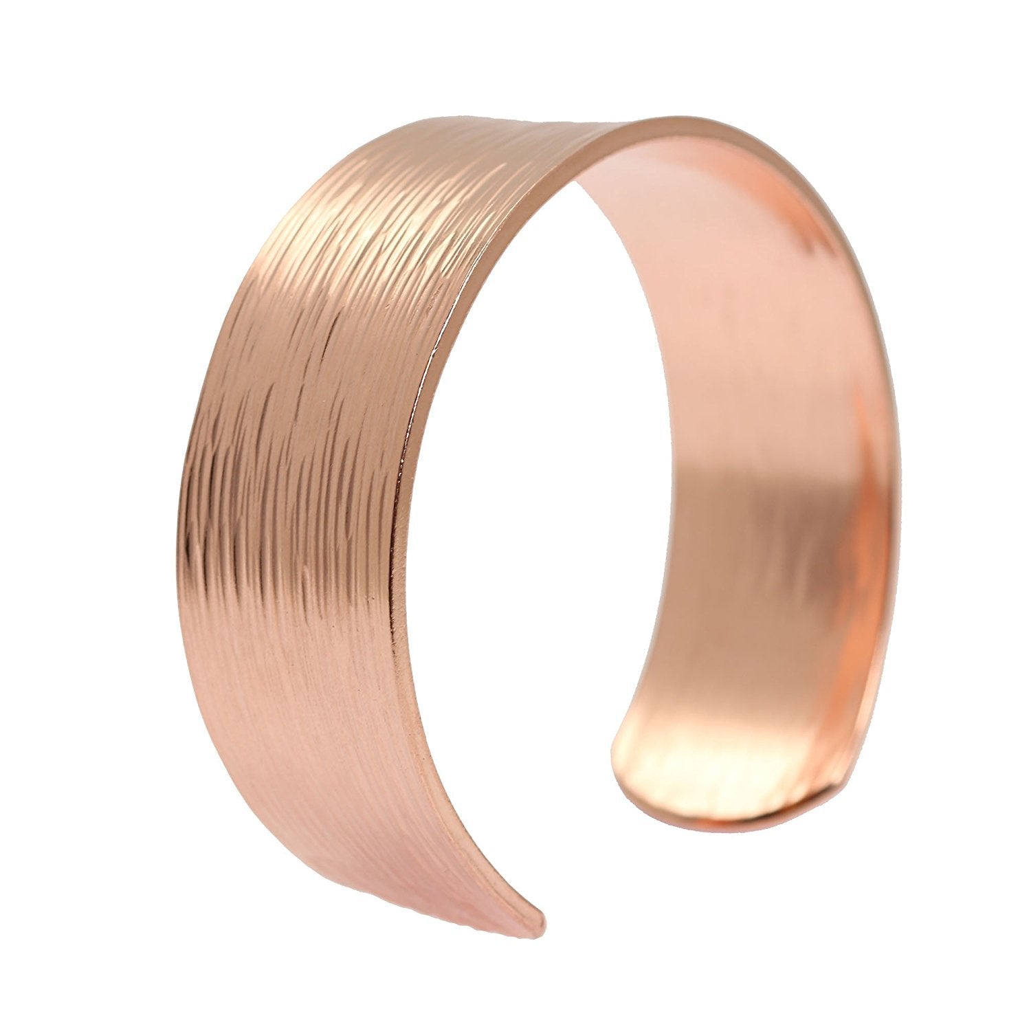 3/4 Inch Wide Chased Copper Bark Cuff Bracelet photographed at an angle on a white background. The open cuff features a warm polished finish, softly rounded edges, and fine linear bark-like texture across the outer surface. The broad curved band tapers gently toward the ends, while the smooth interior adds a clean finished look.