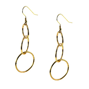 6 of 8: Pair of 3 Tiered Hammered Nu Gold Brass Chandelier Earrings shown from an angled side view, highlighting the open linked construction, movement between the three round tiers, polished hammered texture, and slender French ear wires.