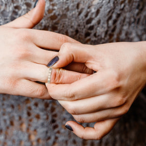 4 of 9: Two hands with polished fingernails trying on a 3mm Matte Stainless Steel Flat Ring 