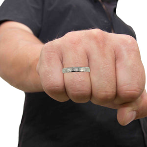 2 of 10: A Man's Hand wearing a 3mm Bark Stainless Steel Comfort Fit Ring with a blurred background