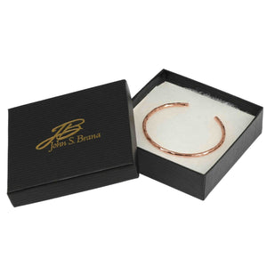 7 of 8: 3mm Wide Hammered Solid Copper Cuff Bracelet in a black box with 'John S. Brana' logo.