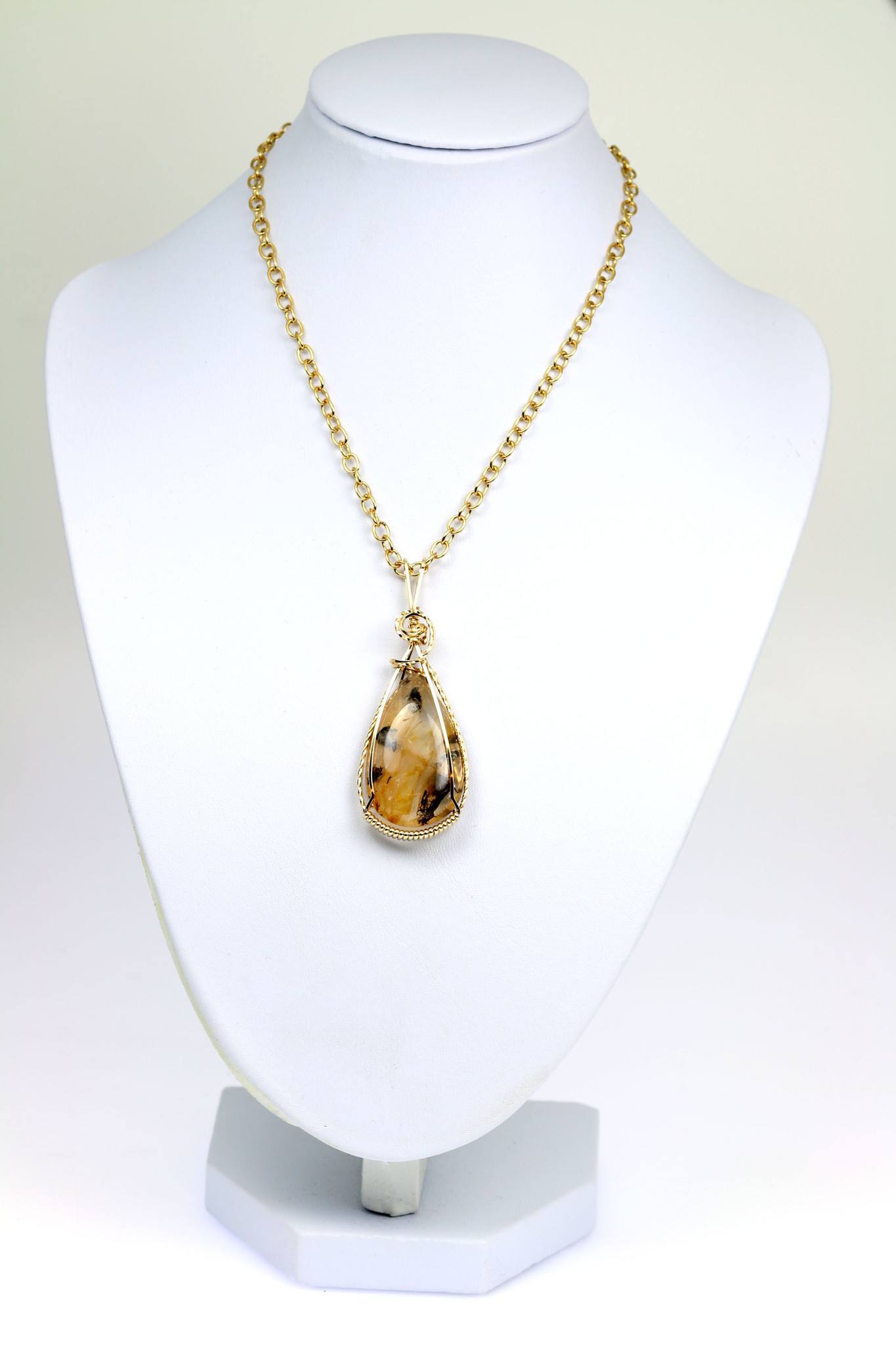 Dendritic Quartz 14K Gold-filled Wrapped Pendant with Chain on a White Neck Display