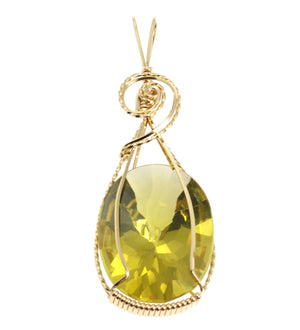 1 of 4: A 49.5 CT Oval Green Gold Quartz 14K Gold-filled Pendant on a White Background