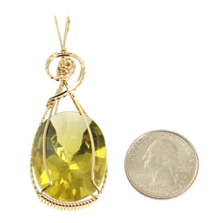 2 of 4: Size of Oval Green Gold Quartz 14K Gold-filled Pendant compared to a US Quarter Coin