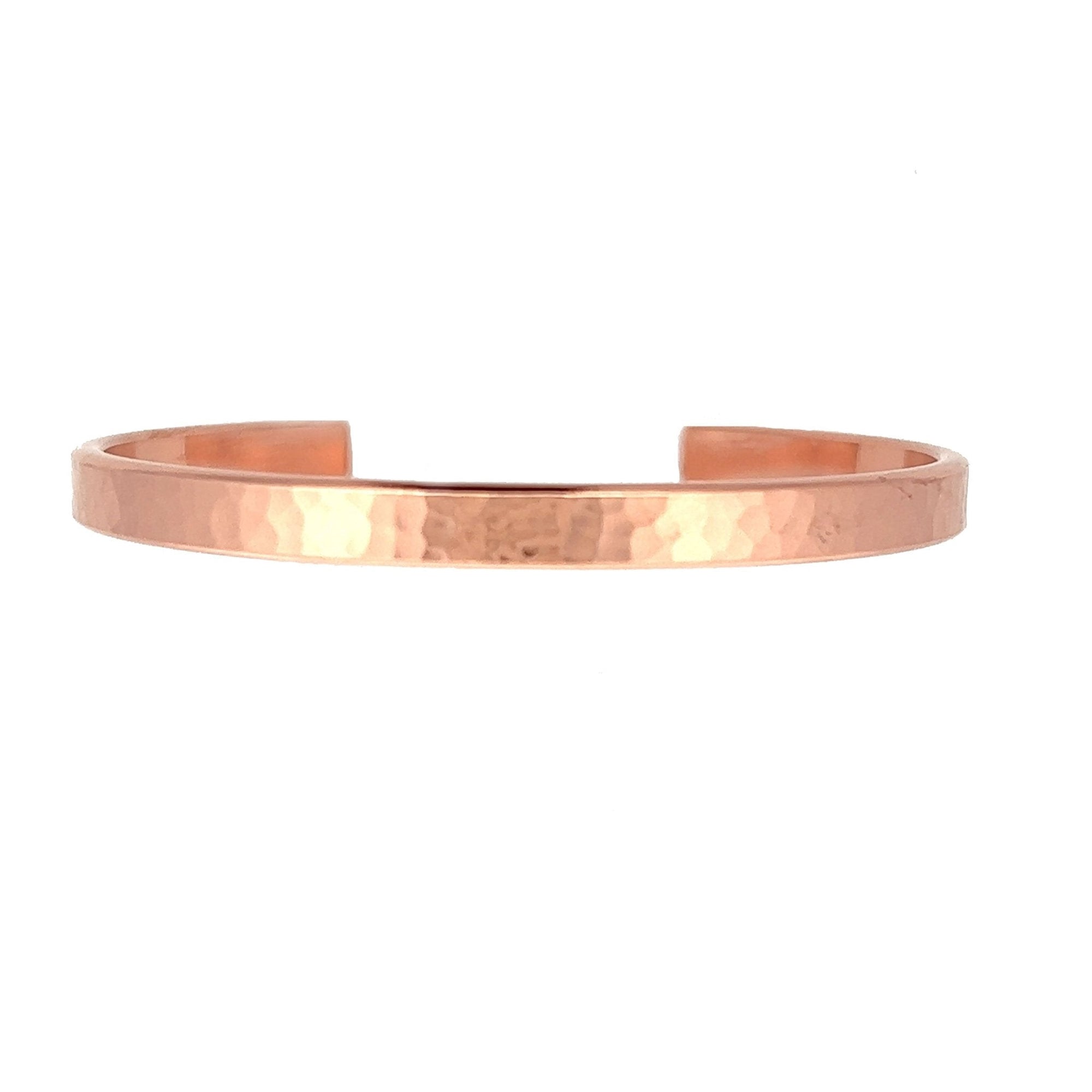 Detail of 4mm Wide Hammered Copper Cuff Bracelet Laying Flat on a White Background