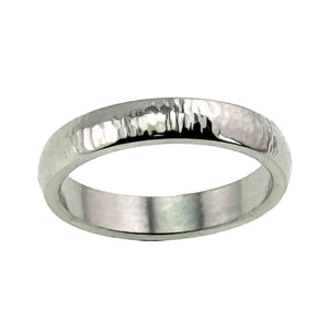 3 of 9: Front angled product view of a 4mm chased stainless steel domed ring on a white background. The polished 316L stainless steel band has a bright mirror finish, hand chased marks across the rounded outer surface, and a smooth flat interior.