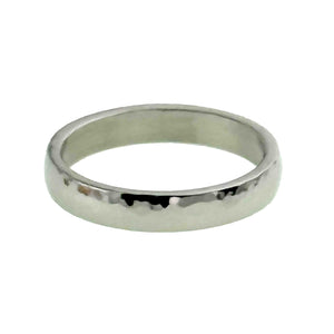 3 of 10: A 4mm hammered stainless steel domed ring is shown from a low front angle on a white background. Its rounded outer profile, mirror polished finish, hand hammered texture, and smooth flat interior can be seen clearly.