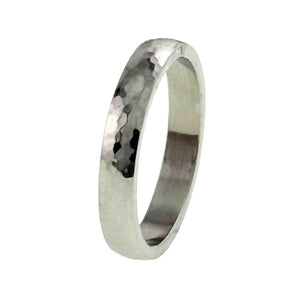 5 of 10: A 4mm hammered stainless steel domed ring stands upright on a white background. The side view shows the ring’s slim width, rounded outer surface, flat inner wall, polished edges, and hand hammered finish.