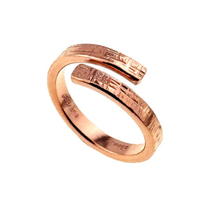 1 of 9: Handmade copper bypass ring with a linen textured surface, shown on a white background with an open wrap design