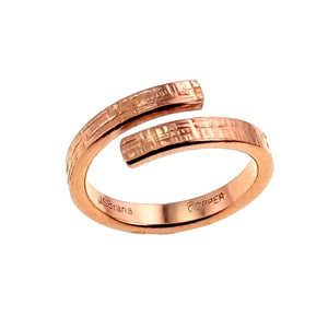 3 of 9: Handmade copper bypass ring with linen textured finish, shown from a side angle on a white background
