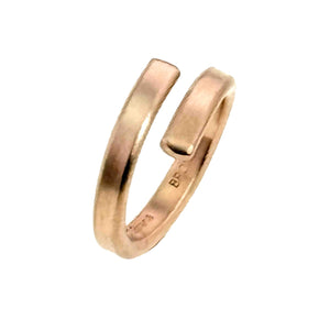 5 of 9: A close-up image of a 4mm matte bronze bypass ring featuring a brushed finish. The ring has a sleek, modern design with slightly overlapping open ends and a smooth, warm bronze tone.