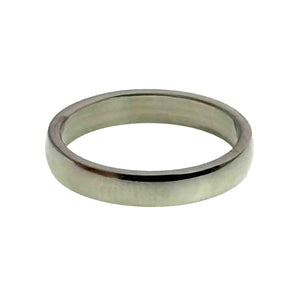 3 of 9: Front angled view of a 4mm polished stainless steel domed ring resting horizontally on a white background. The mirror finish reflects dark and light tones, while the flat interior and rounded outer surface are clearly visible.