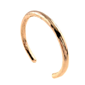 1 of 10: Three quarter product view of the 5.25mm hammered solid bronze cuff bracelet by John S. Brana against a white background. The handmade bracelet features a polished golden bronze finish, individually hammered texture, rounded edges, and a classic open cuff design. Crafted from 92% copper and 8% tin, this sturdy bronze bracelet makes a thoughtful traditional 8th wedding anniversary gift for men or women.