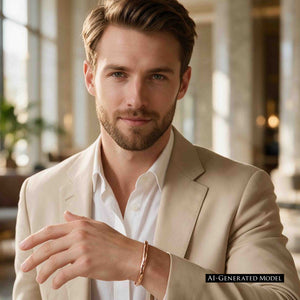 2 of 10: AI generated male model wearing a 5.25mm hammered bronze cuff bracelet by John S. Brana with a beige blazer and white dress shirt. The polished solid bronze bracelet displays its warm golden tones and handcrafted hammered surface. The image demonstrates how this sturdy, minimalist bronze cuff complements contemporary men's dress clothing and smart casual fashion.