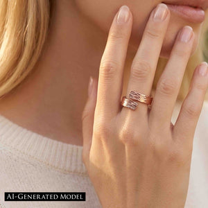 2 of 9: Close view of a woman wearing the bark copper bypass ring with a cream sweater, showing the textured copper wrap design, polished finish, and warm metal color against a soft neutral outfit.  AI Generated Model.