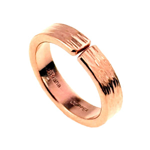 1 of 9: Three quarter view of a handmade 5.5mm bark copper cuff ring on a white background, showing the open ends, polished copper shine, natural wood inspired texture, smooth inner band, and stamped maker and copper marks.