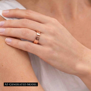 2 of 9: Close view of a woman wearing a polished 5.5mm bark copper cuff ring with a white top, showing the open ends, hand textured surface, warm copper color, and comfortable medium width on the finger.  AI Generated Model.