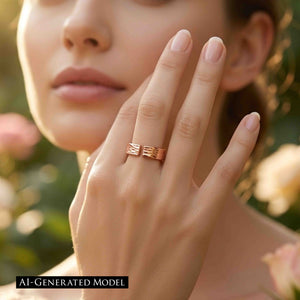 8 of 9: Woman wearing a 5.5mm bark copper cuff ring on her finger in a softly lit garden setting, showing the open front, hand applied texture, warm polished copper color, and easy everyday styling.  AI Generated Model.