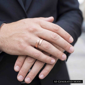 4 of 8: Close view of a person in a dark suit wearing a polished chased copper bypass ring on the ring finger. The open ends overlap across the top, showing the hand applied linear texture and warm rose copper color.  AI Generated Model.
