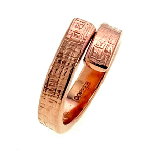 4 of 8: Close up detail of the textured ends on a 5.5mm linen copper bypass ring. The raw solid copper ring displays a handcrafted linen finish with overlapping open edges and warm earthy color on a white background.