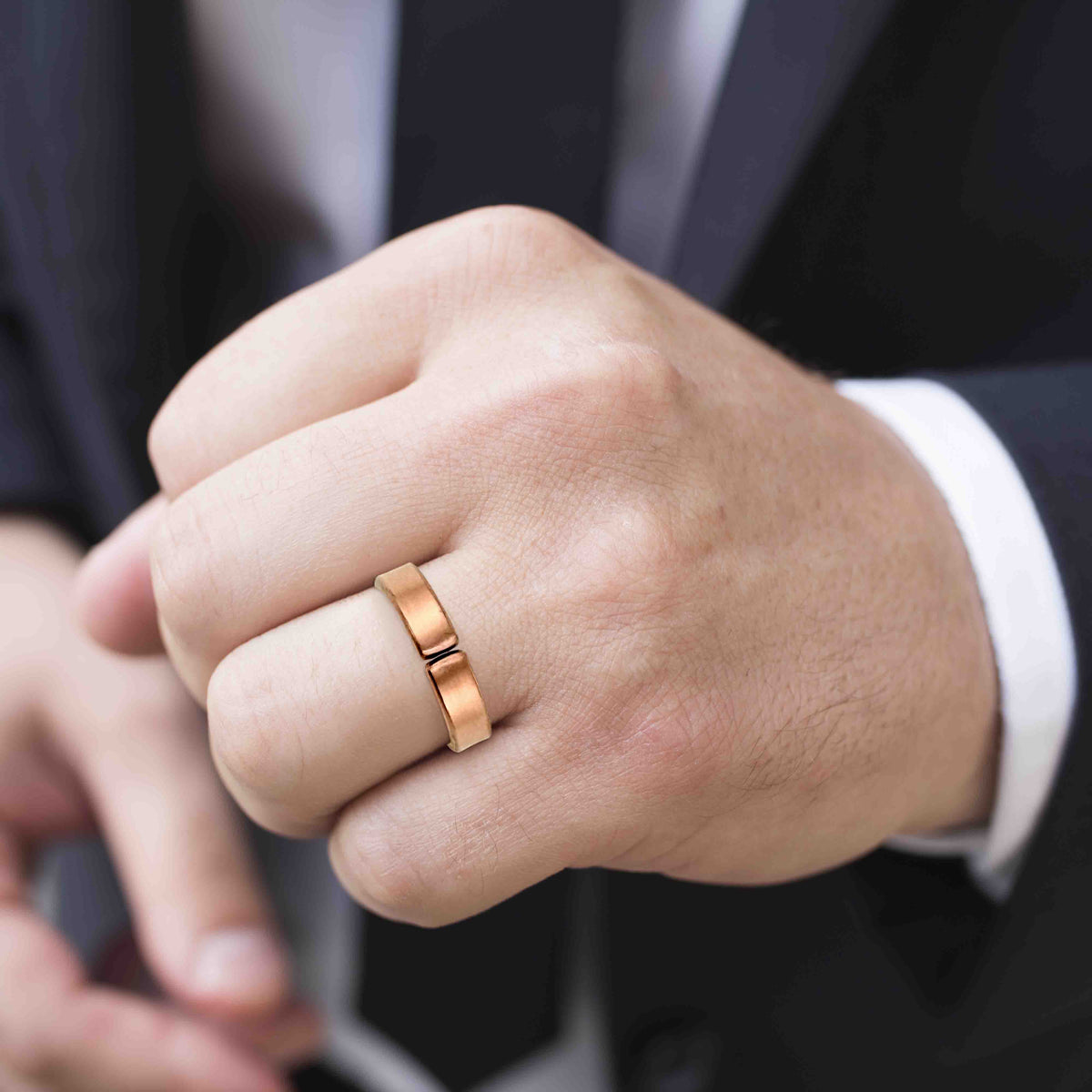 Matte 5.5 wide copper cuff ring on finger, satin finish, simple modern band profile, warm muted copper tone