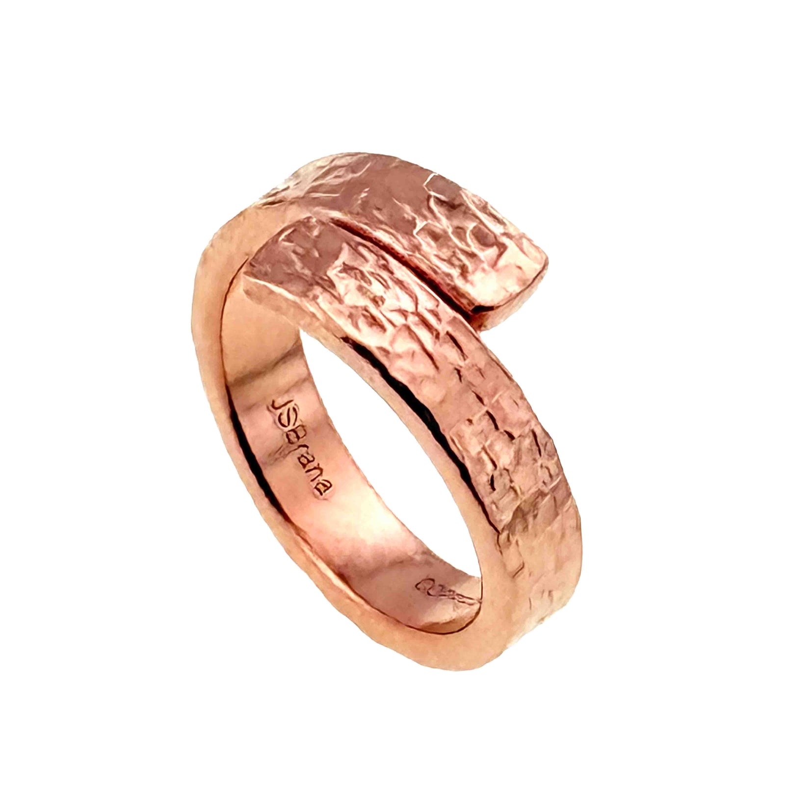 Studio side view of a 5.5mm texturized copper bypass ring on white background, showing the curved solid copper band, overlapping open ends, polished shine, and textured surface.
