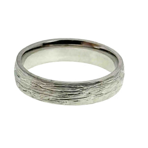 3 of 9: A close-up image of a 5mm wide stainless steel ring with a hand-carved bark texture on the outer surface and a high-polished, domed interior. The ring is made from 316L surgical stainless steel and features a smooth, reflective inner band for a comfort fit. The outer texture mimics the organic lines of tree bark, adding a rugged, natural look to the otherwise sleek and modern design. The ring is isolated on a plain white background, emphasizing its detailed craftsmanship and contrast between texture and shi