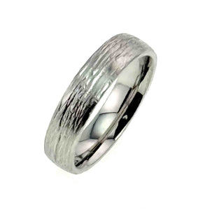 5 of 9: A high-resolution image of a 5mm wide stainless steel ring featuring a hand-carved bark texture on the outer surface and a polished, domed interior for a comfort fit. The ring is made from 316L surgical stainless steel, known for its durability and resistance to tarnish. The close-up angle highlights the contrast between the matte, organic bark pattern and the smooth, reflective inner band. The ring is photographed against a plain white background, emphasizing its handcrafted detail and modern design.