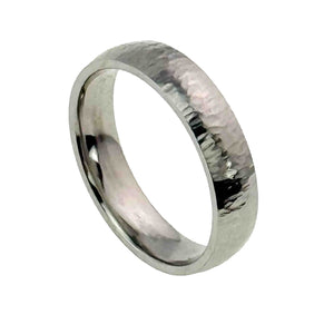 1 of 8: Three quarter product view of a 5mm chased stainless steel comfort fit ring on a white background. The polished silver tone band displays its domed shape, smooth inner surface, and varied chased marks that catch the light.